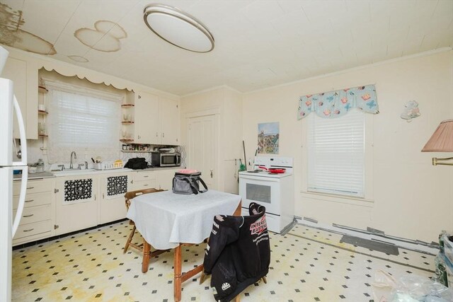kitchen featuring a sink, light floors, open shelves, and electric range