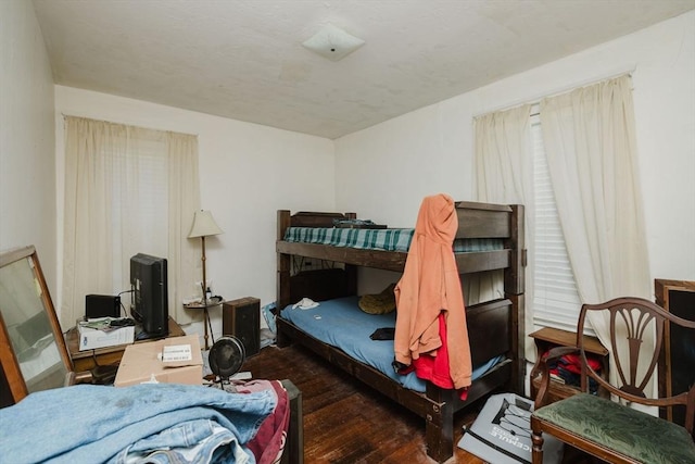 bedroom with wood finished floors