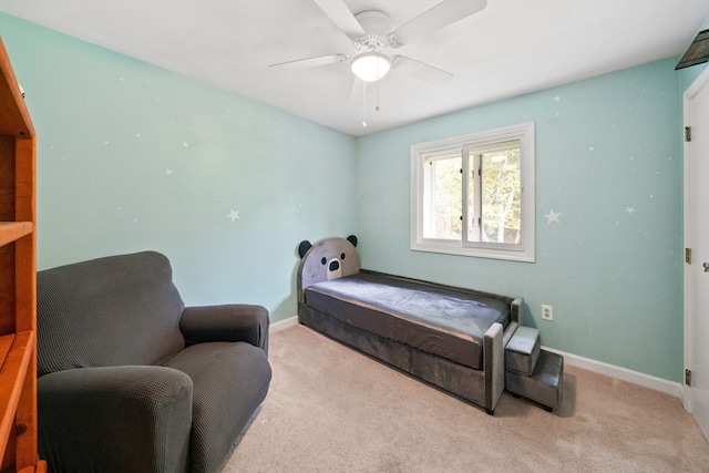 bedroom featuring ceiling fan and light colored carpet