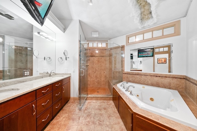 bathroom featuring vanity, shower with separate bathtub, and tile patterned flooring