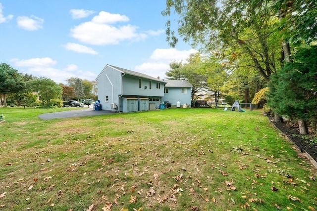 view of yard featuring a garage