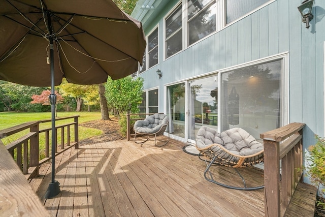 wooden deck with a yard