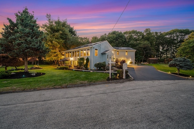 view of front of house featuring a lawn