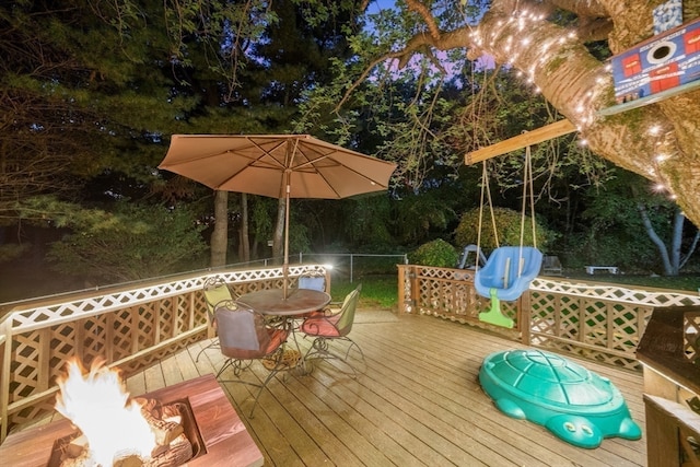 wooden deck featuring a fire pit