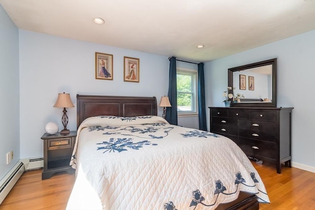 146 S Main St, Natick, MA 01760 - bedroom featuring light wood-style floors, baseboard heating, recessed lighting, and baseboards