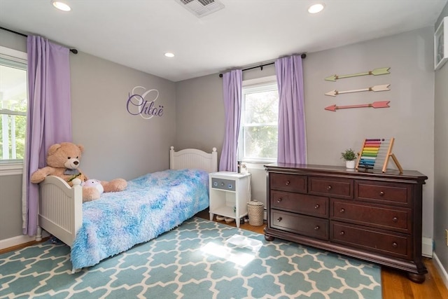 146 S Main St, Natick, MA 01760 - bedroom featuring recessed lighting, wood finished floors, radiator, and baseboards