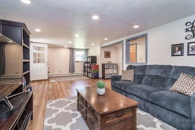 146 S Main St, Natick, MA 01760 - living room featuring light wood-style flooring, recessed lighting, baseboards, and a baseboard radiator