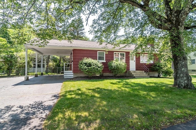 146 S Main St, Natick, MA 01760 - view of front of home featuring asphalt driveway, entry steps, a carport, and a front lawn