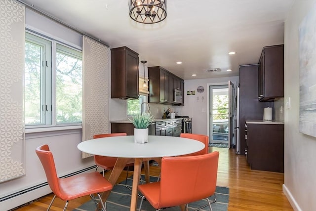 146 S Main St, Natick, MA 01760 - dining space with a baseboard radiator, light wood-type flooring, and recessed lighting