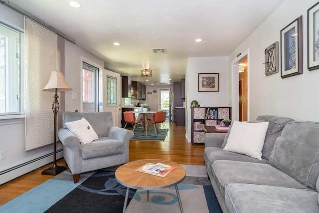 146 S Main St, Natick, MA 01760 - living room featuring wood finished floors, baseboard heating, and recessed lighting