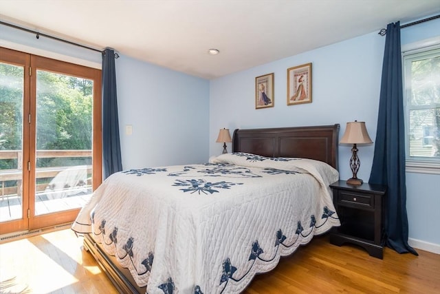 146 S Main St, Natick, MA 01760 - bedroom with multiple windows, access to exterior, light wood-style flooring, and baseboards