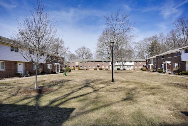 view of yard featuring a residential view