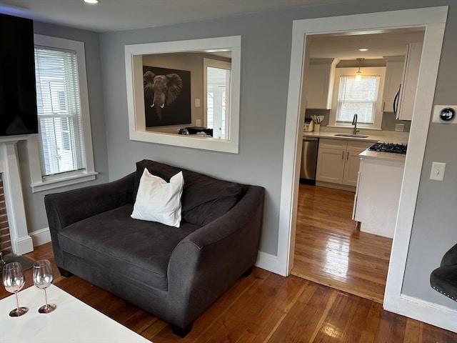 living room featuring dark wood-type flooring and baseboards