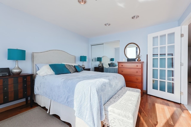 bedroom featuring a closet and wood-type flooring