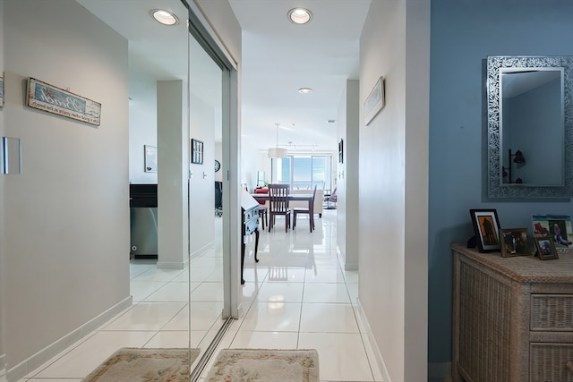 corridor with light tile patterned flooring