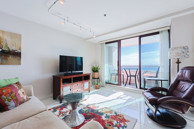 living room featuring track lighting and light tile patterned floors