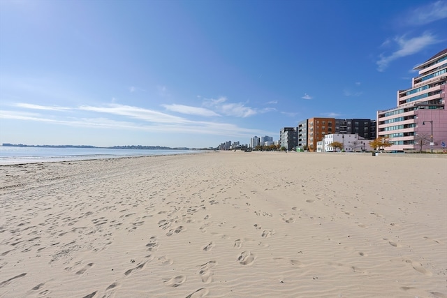 view of property's community with a view of the beach and a water view