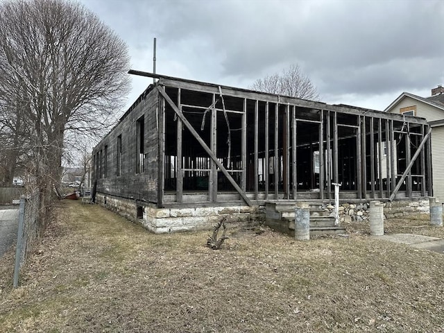 back of house featuring crawl space
