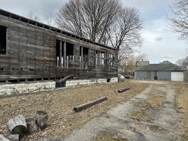 view of side of home with driveway