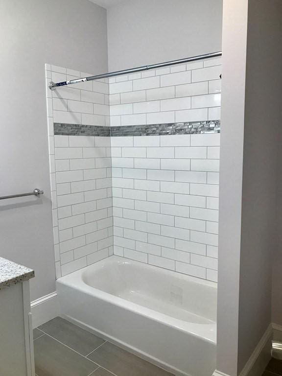 36-38 Coleman St, Boston, MA 02125 - bathroom featuring tile patterned floors, washtub / shower combination, and vanity