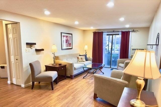 living room with light hardwood / wood-style flooring