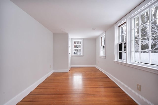 spare room with light hardwood / wood-style flooring