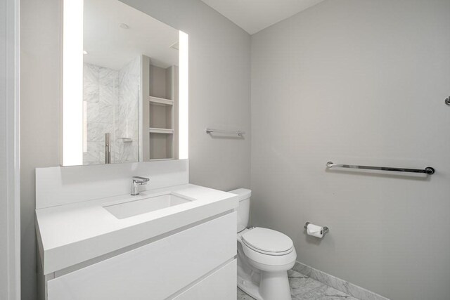 full bathroom featuring walk in shower, baseboards, toilet, marble finish floor, and vanity