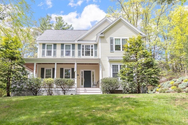 view of front of home featuring a porch and a front lawn