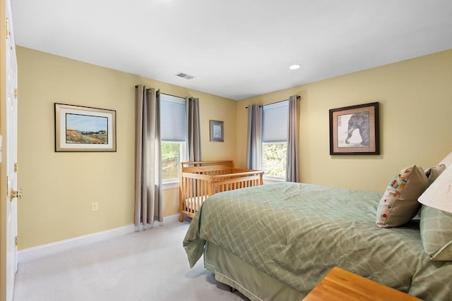 bedroom with light carpet, baseboards, and recessed lighting