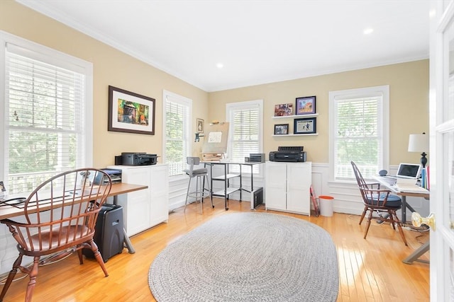 office with healthy amount of natural light, crown molding, light wood-style flooring, wainscoting, and recessed lighting