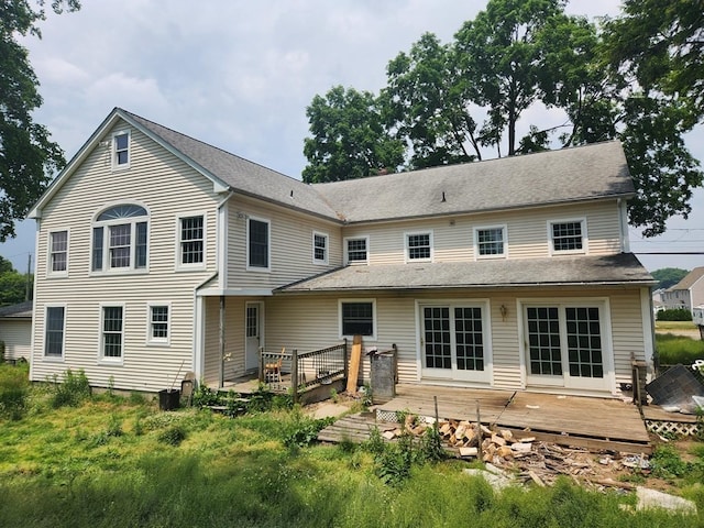 back of house featuring a deck