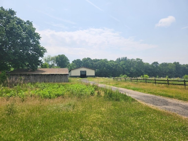 view of yard with a rural view