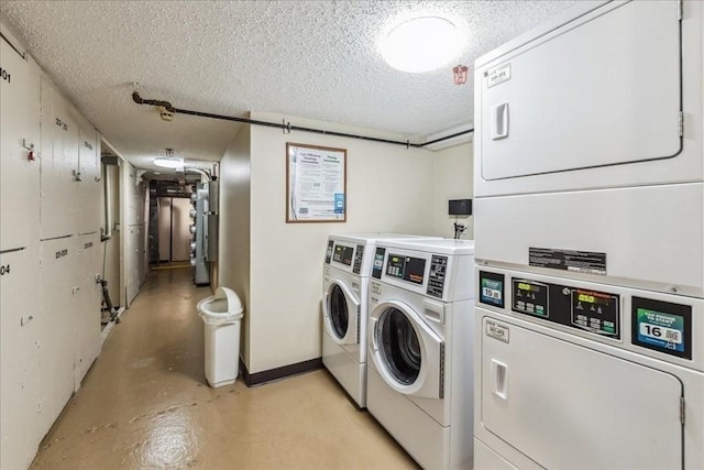 clothes washing area with washing machine and clothes dryer, stacked washer and dryer, and a textured ceiling