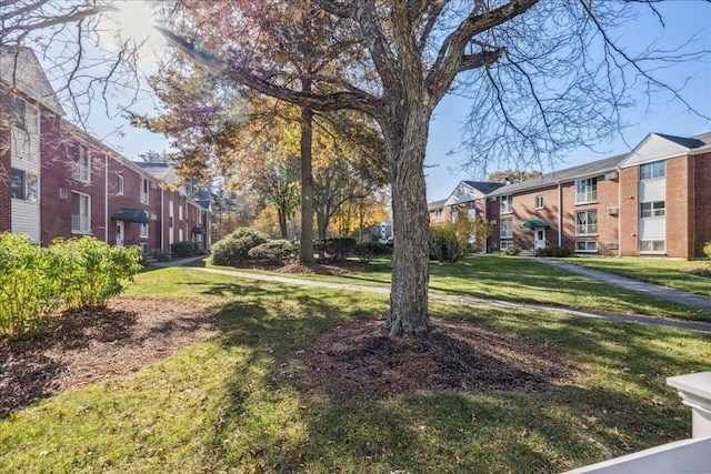 view of home's community with a yard