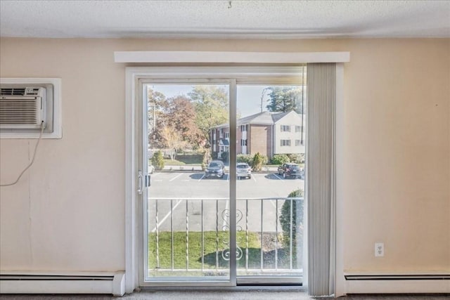 doorway to outside featuring a textured ceiling, a wall mounted AC, and a baseboard heating unit