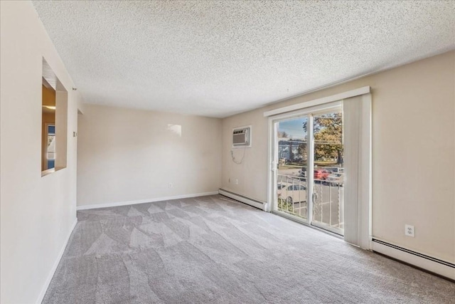 carpeted empty room with a wall mounted air conditioner, a textured ceiling, and a baseboard radiator