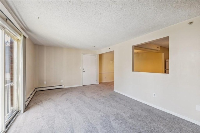 carpeted empty room with a textured ceiling