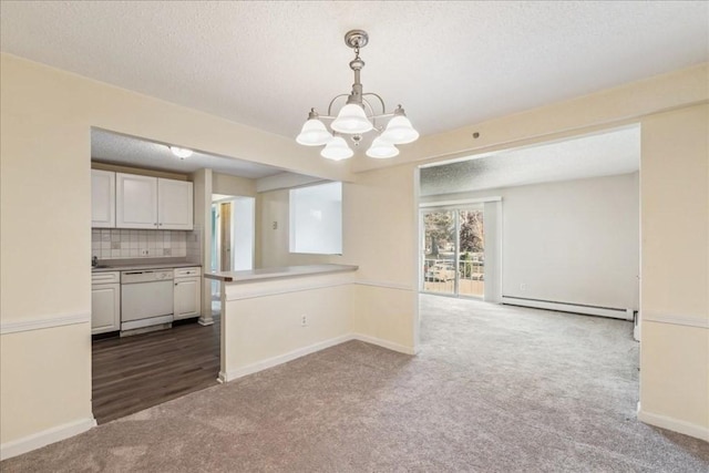 kitchen featuring kitchen peninsula, dark carpet, white dishwasher, a baseboard radiator, and hanging light fixtures