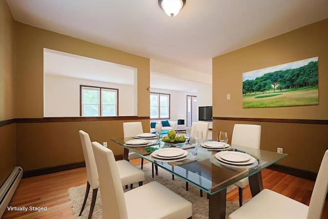 269 Fairview Ave, Rehoboth, MA 02769 - dining area featuring a baseboard heating unit and wood finished floors