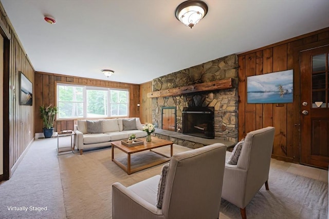 269 Fairview Ave, Rehoboth, MA 02769 - living area with wooden walls, light colored carpet, and a stone fireplace