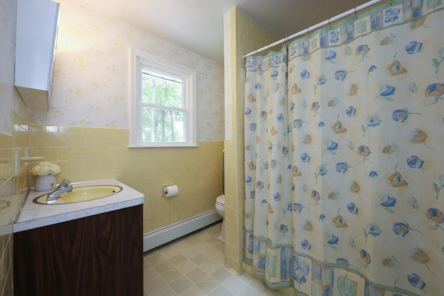269 Fairview Ave, Rehoboth, MA 02769 - full bathroom with baseboard heating, wallpapered walls, tile walls, wainscoting, and vanity
