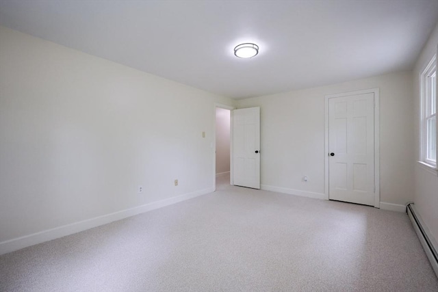 269 Fairview Ave, Rehoboth, MA 02769 - unfurnished bedroom featuring a baseboard heating unit and light carpet