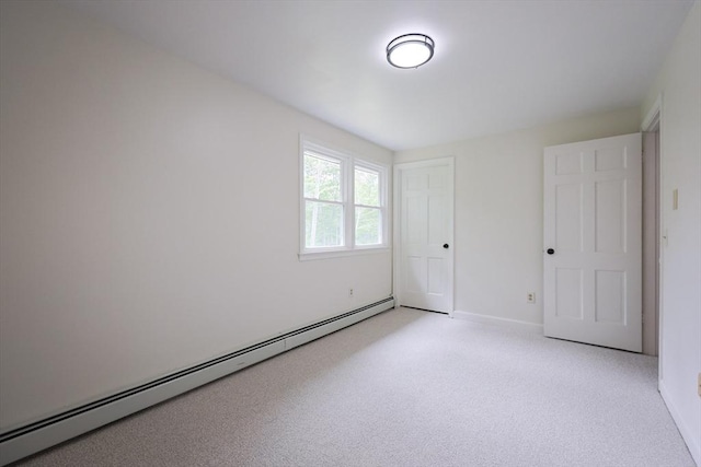 269 Fairview Ave, Rehoboth, MA 02769 - unfurnished bedroom featuring a baseboard heating unit and light colored carpet