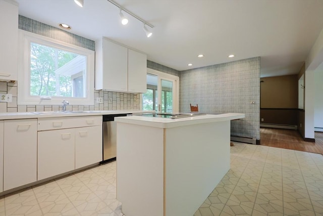 269 Fairview Ave, Rehoboth, MA 02769 - kitchen featuring stainless steel dishwasher, a baseboard radiator, light countertops, track lighting, and white cabinets