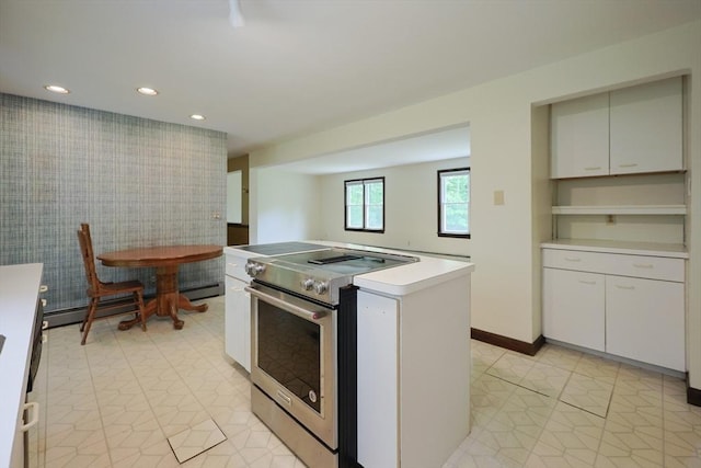 269 Fairview Ave, Rehoboth, MA 02769 - kitchen with stainless steel range with electric cooktop, a kitchen island, recessed lighting, a baseboard radiator, and light countertops