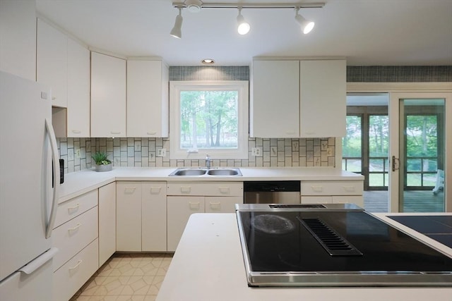 269 Fairview Ave, Rehoboth, MA 02769 - kitchen featuring freestanding refrigerator, stovetop with downdraft, light countertops, and decorative backsplash