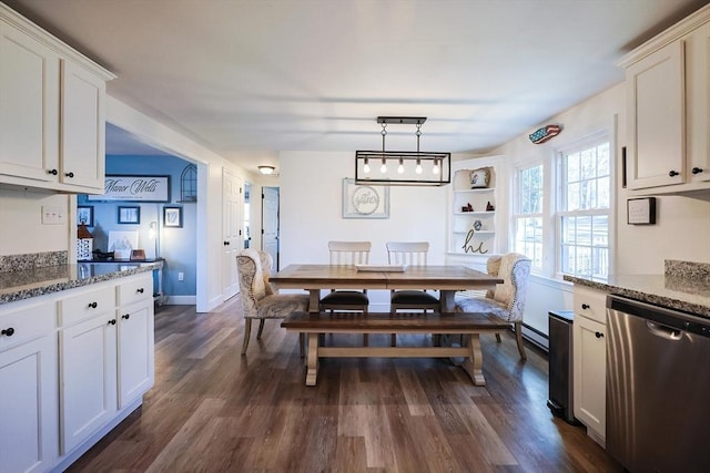 dining space featuring a baseboard radiator, baseboards, and dark wood finished floors