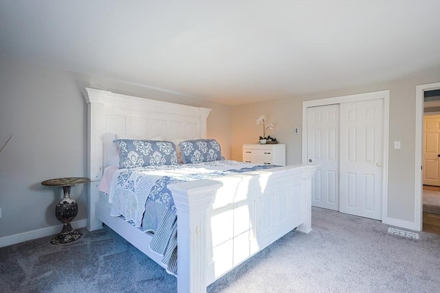 bedroom featuring baseboards, a closet, and light carpet