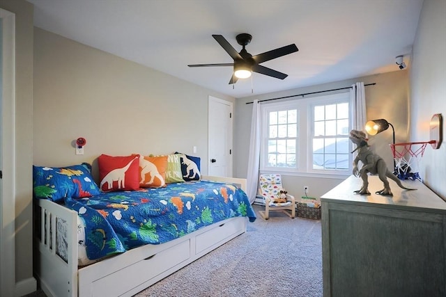 carpeted bedroom featuring a ceiling fan