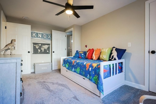 bedroom with carpet flooring, baseboards, and a ceiling fan